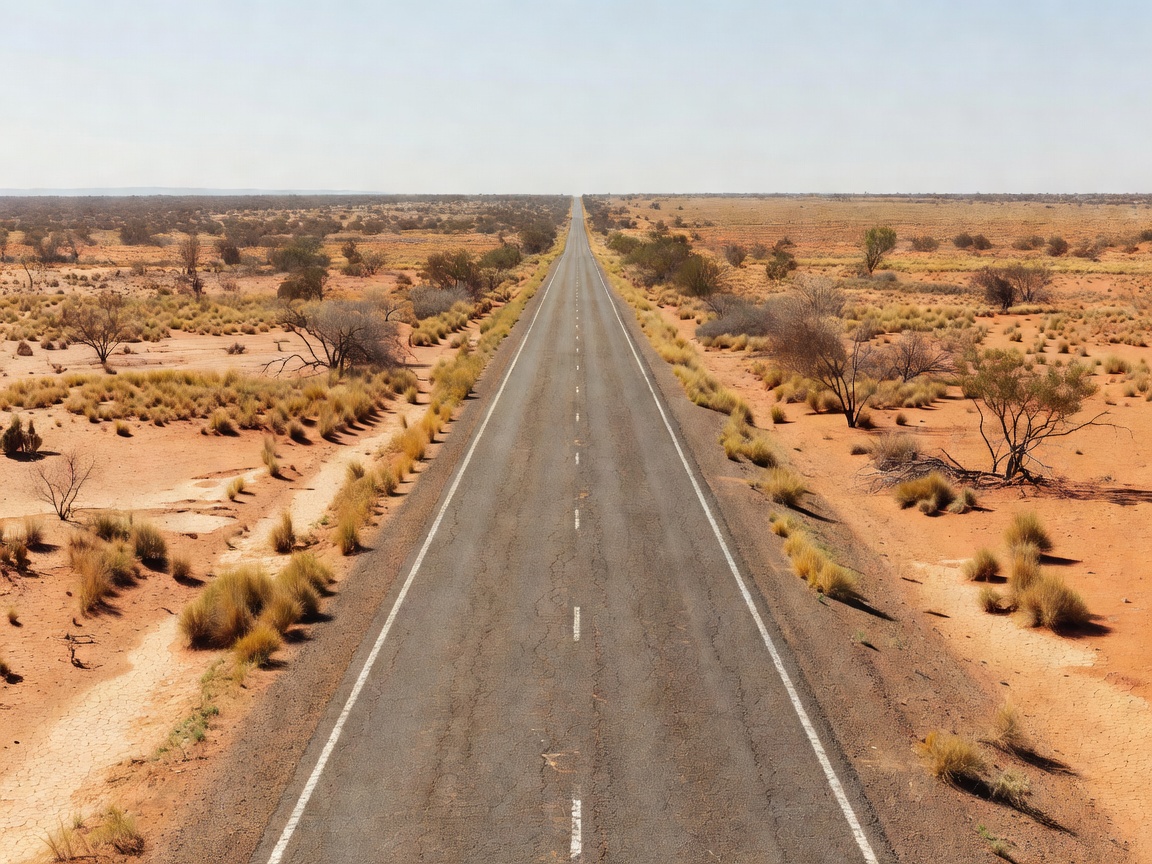 Long straight desert highway running through the arid Australian outback